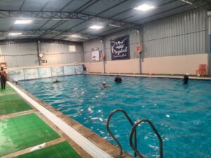 Swimming skill development for adults at Krystal Swimming Pool – Ameenpur. (1)