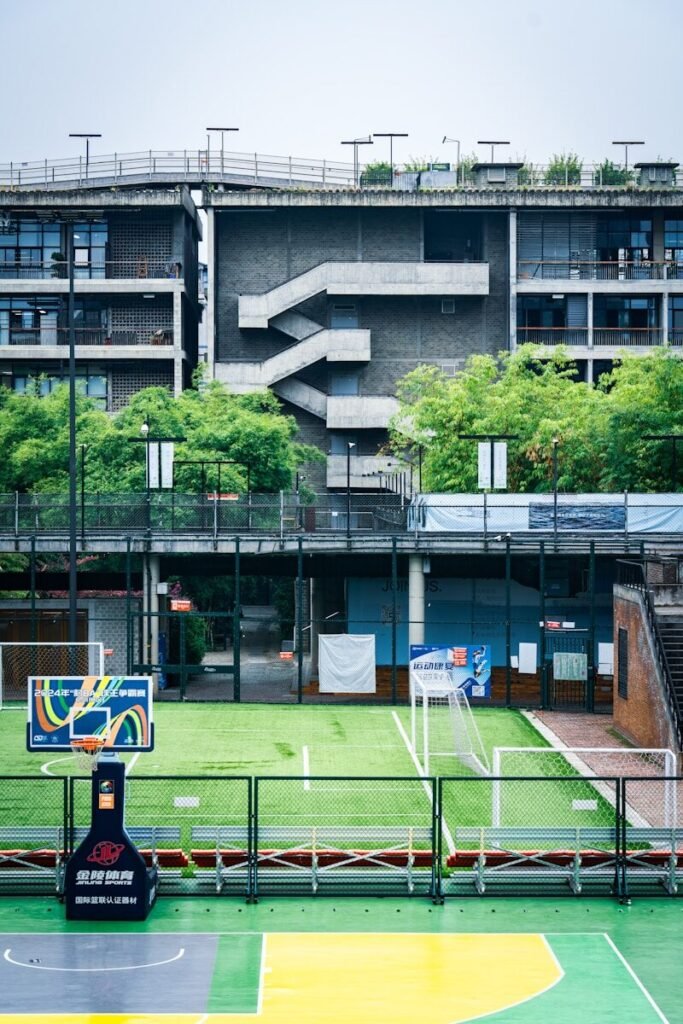 Multisport court with basketball hoop and goals.